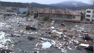 Tsunami in Kesennuma city ascending the Okawa river [upl. by Heim]